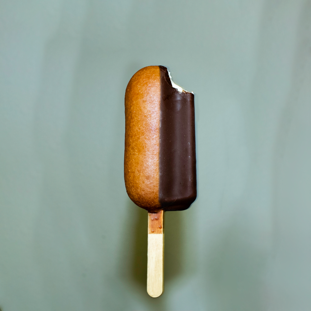 The uncomfortable combination of a corndog and an iceream bar.